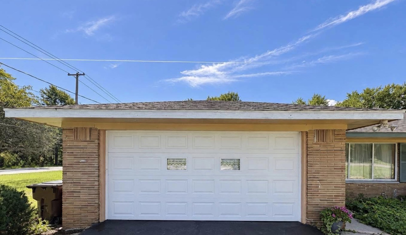 White garage door installed on a brick Ohio home